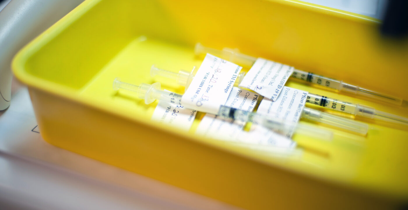 Vaccine shots laying in a tray