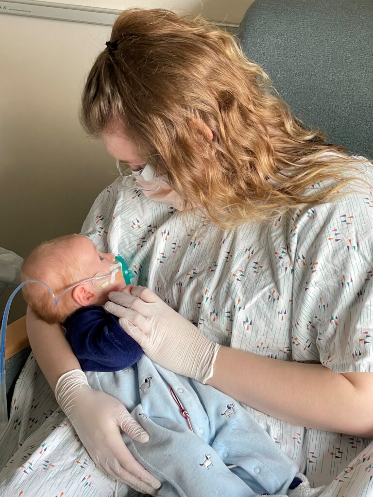 Nurse holding baby