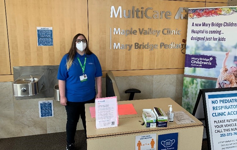 Woman standing at a receptionist desk