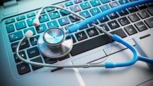 Stethoscope laying on a keyboard