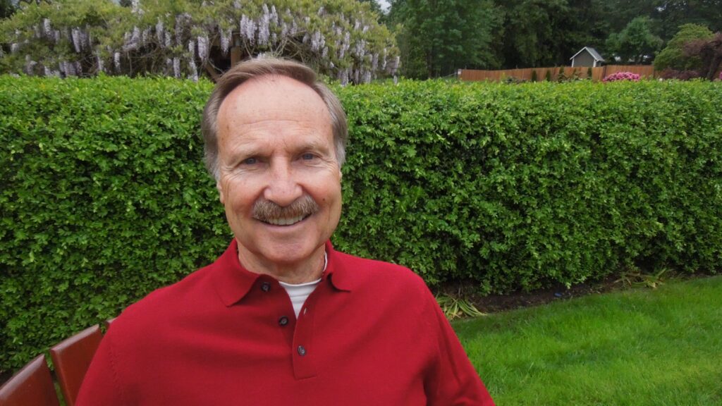 Man smiling in garden