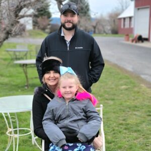 A woman with her husband and child.