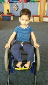 Little boy sits in wheelchair at Children’s Therapy Unit