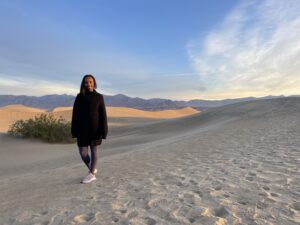 A woman standing in a desert