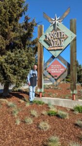 Person in front of road signs.