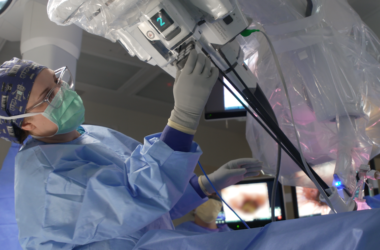 Video still of a surgeon performing robotic surgery