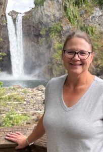Woman in front of waterfalls