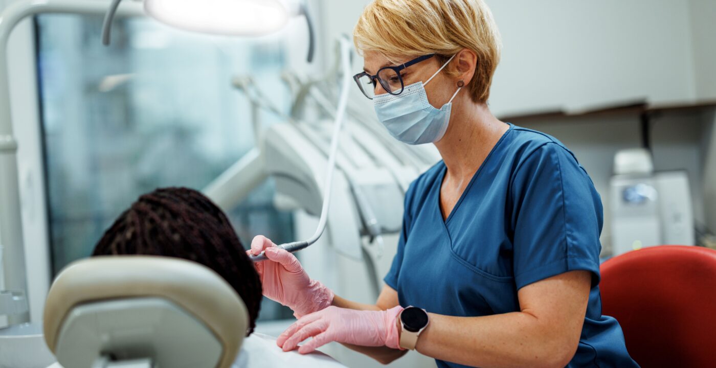 A dentist treating a patient