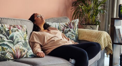 Shot of a young woman resting on the sofa at home
