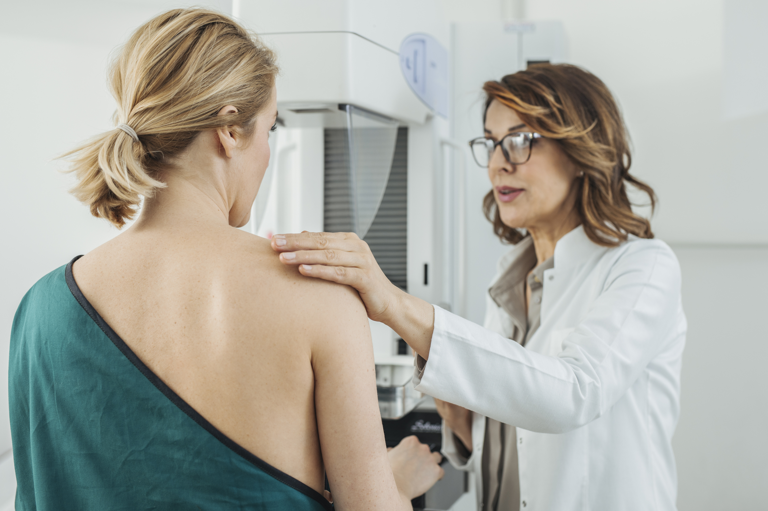 Woman Physician Talking With Her Mammogram Patient