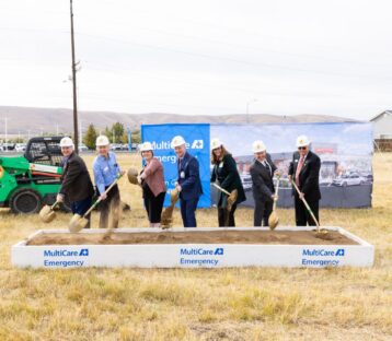 MultiCare team lines up with shovels to officially break ground on construction.