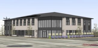 two-story rendering of the future therapy center building depicts a freestanding structure with floor-to-ceiling lobby windows lined by landscaping along one side.